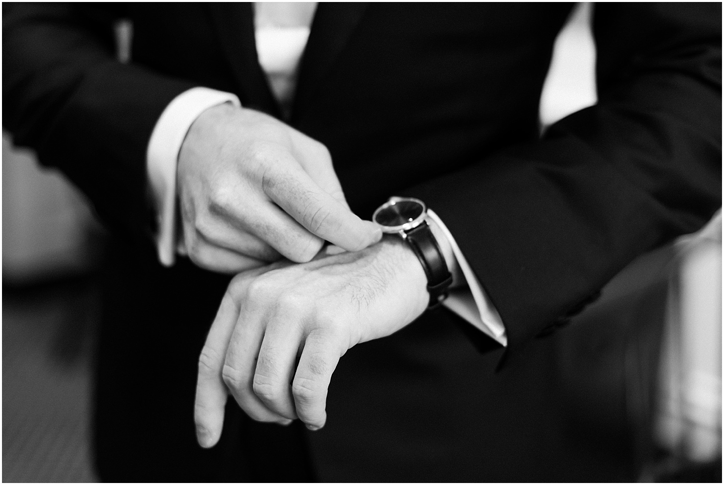 Groom adjusting Movado Watch | Blush and Black Tie Wedding in Williamsburg, VA | Sarah Bradshaw Photography