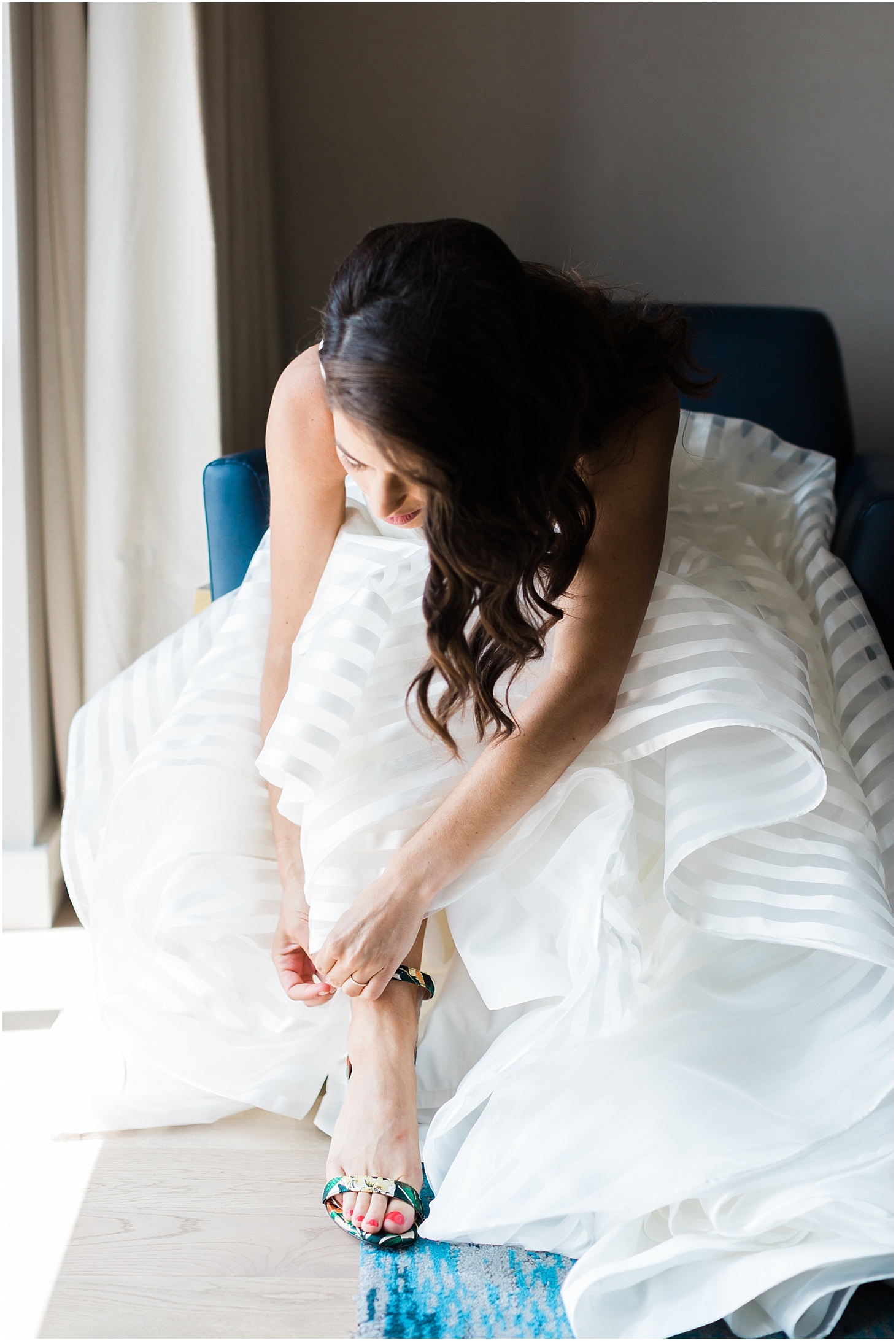 Bride Getting Ready in the Water Suite at the Intercontinental Hotel - The Wharf | Hayley Paige Wedding Gown and Stuart Weitzman Shoes | Chic and Modern Interfaith Wedding at District Winery in Washington, DC | Sarah Bradshaw Photography