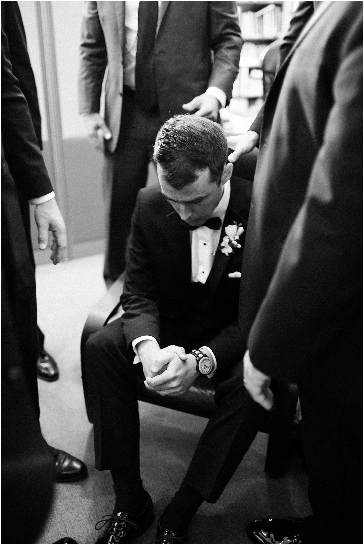 Groom and Groomsmen Praying before Ceremony at Capitol Hill Baptist Church, Black Tie Hay-Adams Wedding with Summer Florals, Ceremony at Capitol Hill Baptist Church, Sarah Bradshaw Photography, DC Wedding Photographer