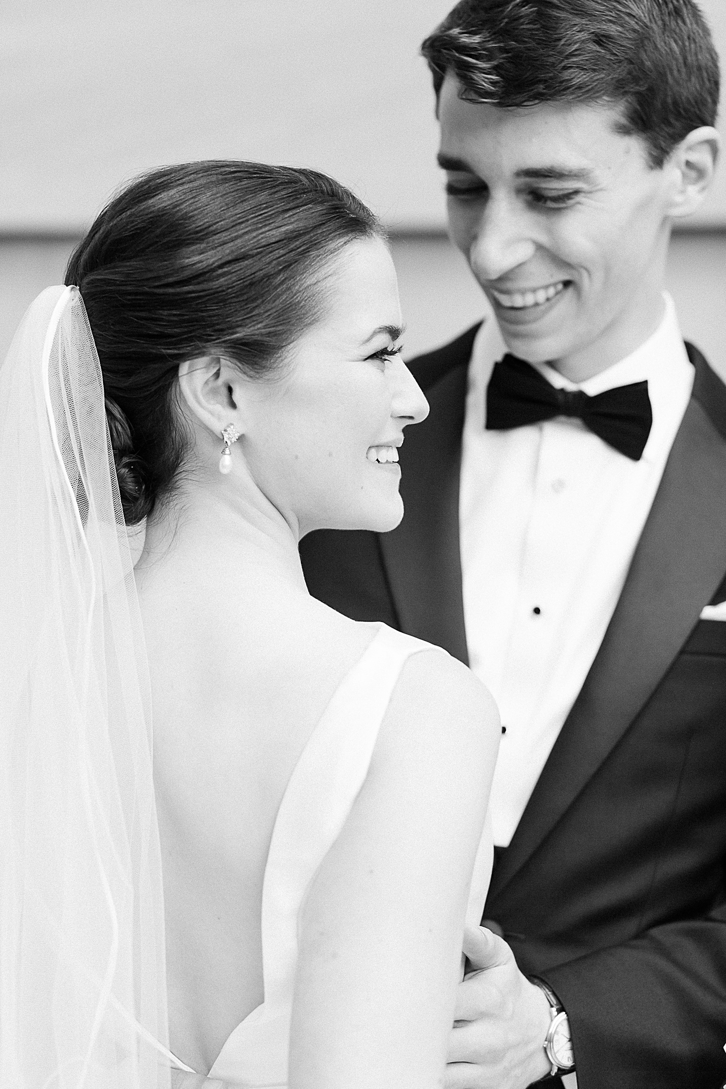 Black and white laughing at Anderson House Wedding by Sarah Bradshaw