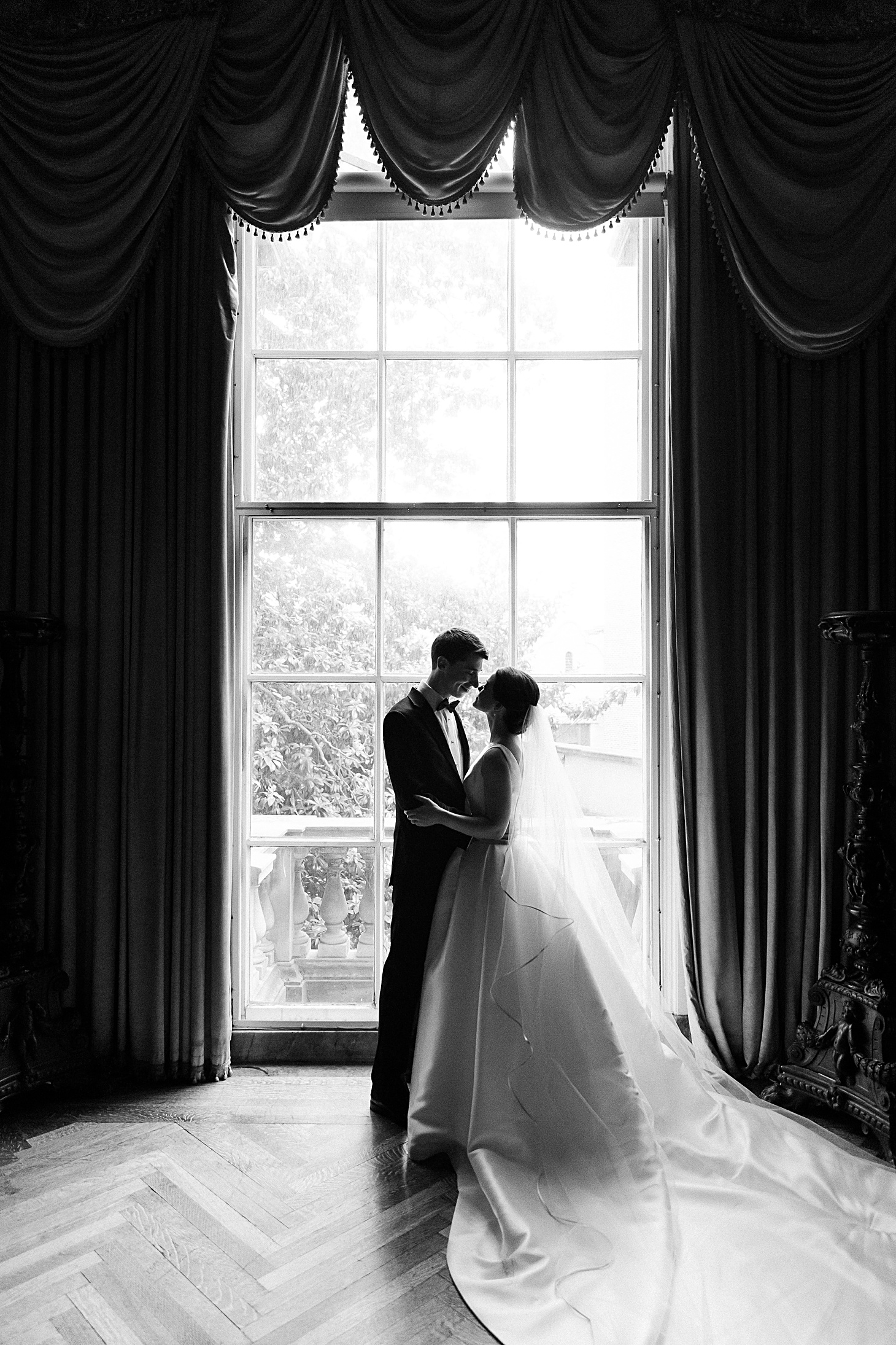 Bride & groom in window at Anderson House Wedding by Sarah Bradshaw