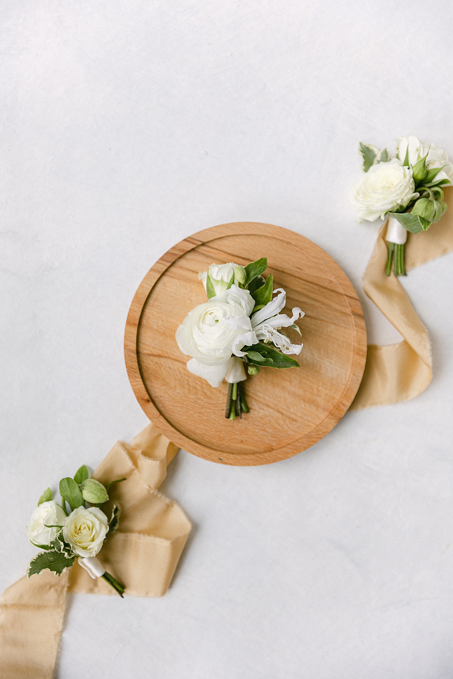 Organic soft white boutonnière by Kate Asire at Old Edwards Inn wedding by Sarah Bradshaw Photography
