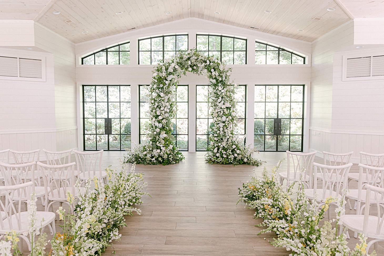 Organic white ceremony arch Orchard House at Old Edwards Inn wedding by Sarah Bradshaw Photography