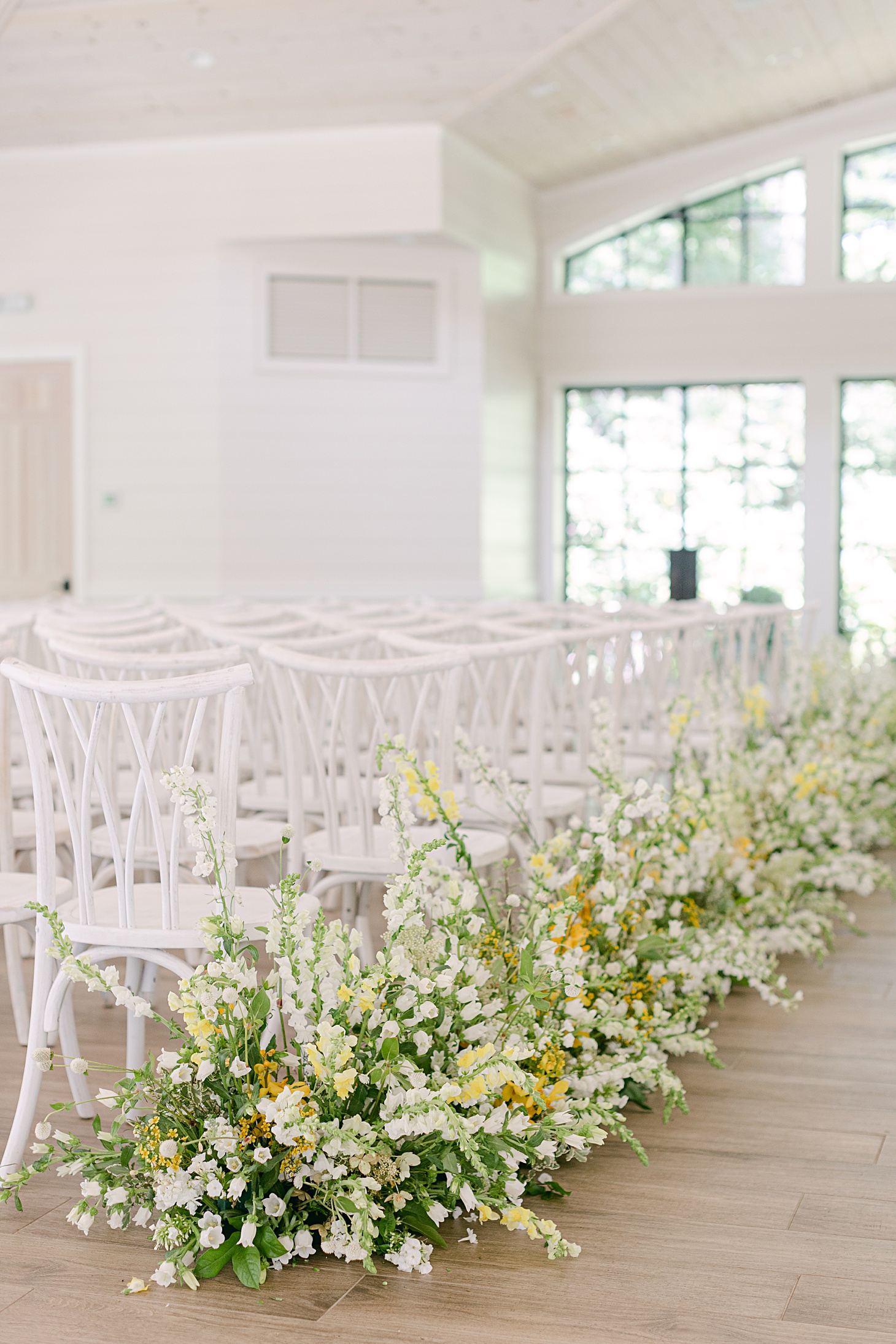 Organic white and yellow ceremony aisle at Orchard House at Old Edwards Inn wedding by Sarah Bradshaw Photography
