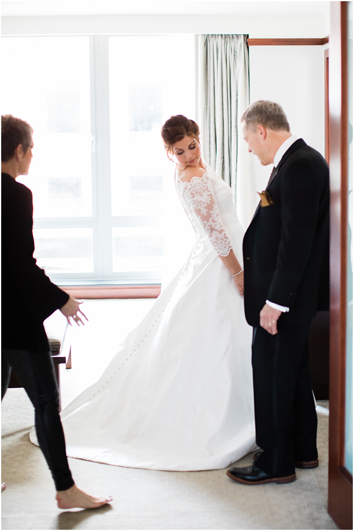 Bride getting dressed at The Ritz-Carleton Georgetown |  | The 10 Best DC Hotels for  Getting Ready on Your Wedding Day