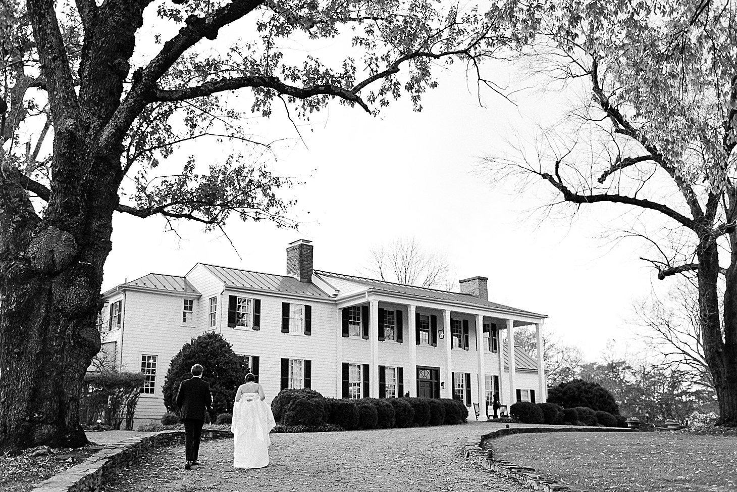 Couple walking at wedding at The Clifton Charlottesville by Sarah Bradshaw Photography