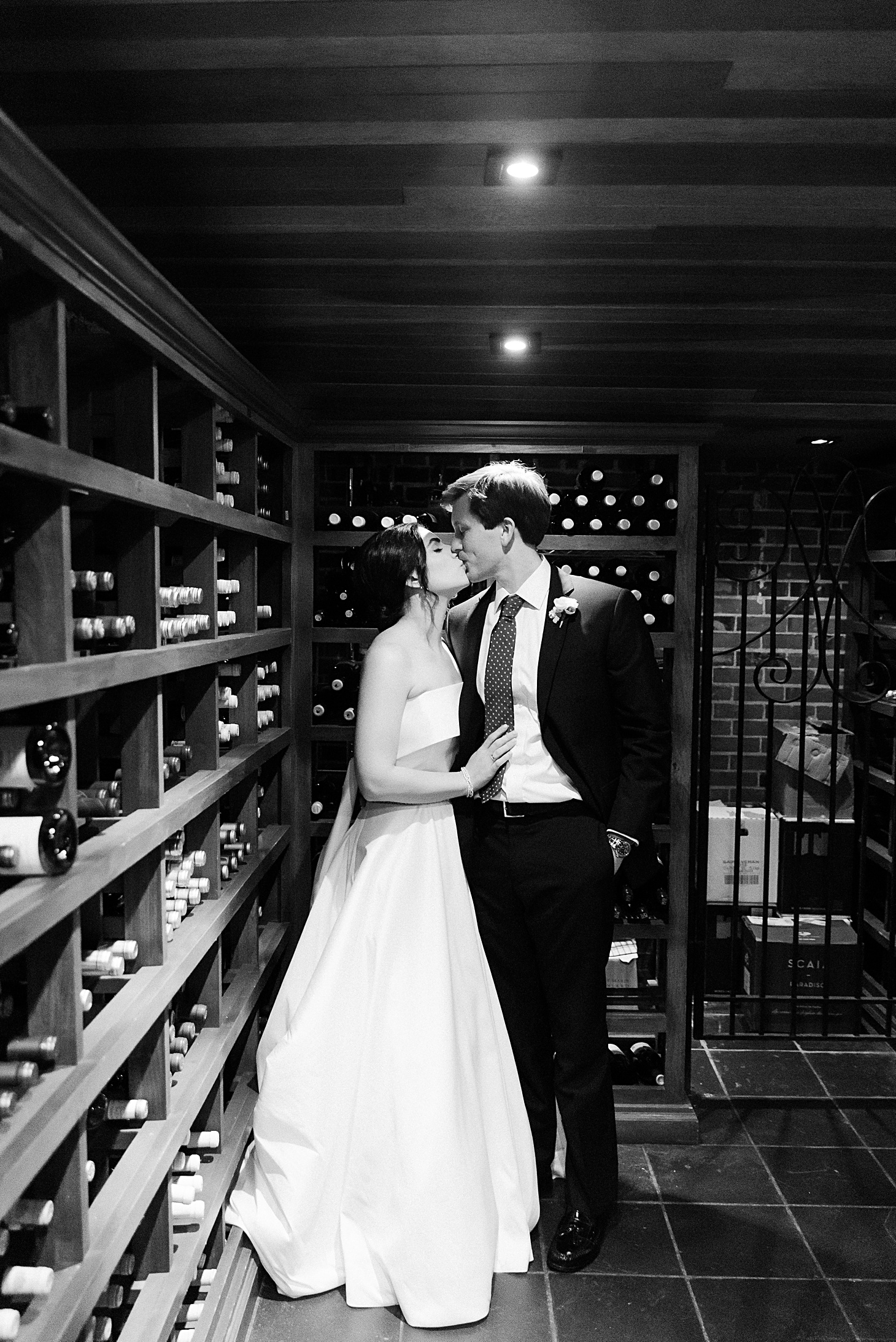 Bride & groom in wine cellar at wedding at The Clifton Charlottesville by Sarah Bradshaw Photography