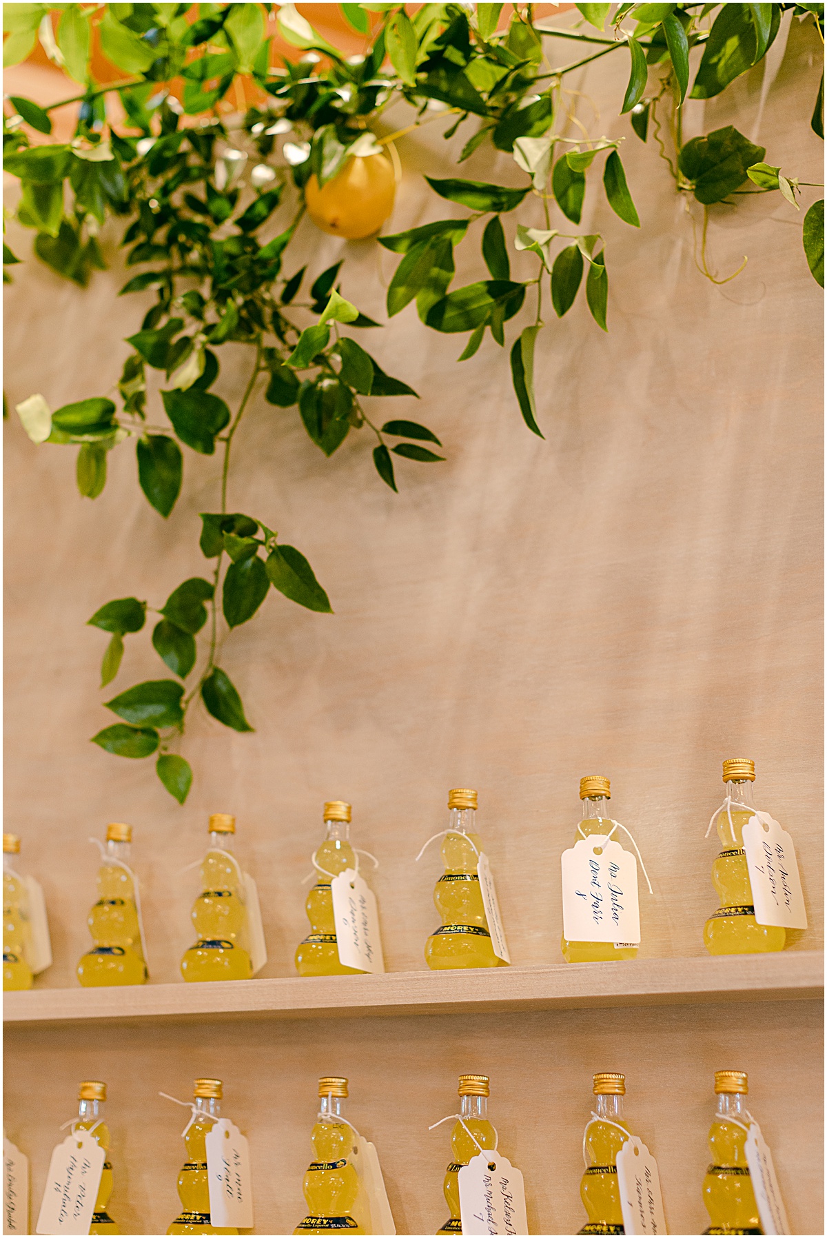 Limoncello escort wall at lemon-themed wedding at Congressional Country Club by Sarah Bradshaw