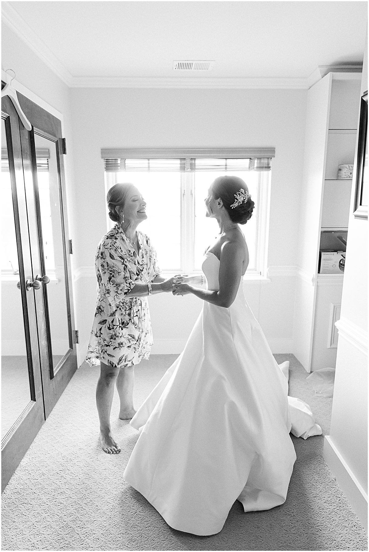 Bride with her mom  at Congressional Country Club wedding by Sarah Bradshaw