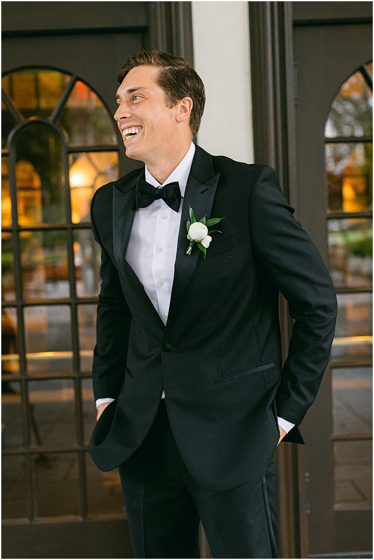 Laughing groom  at Congressional Country Club wedding by Sarah Bradshaw