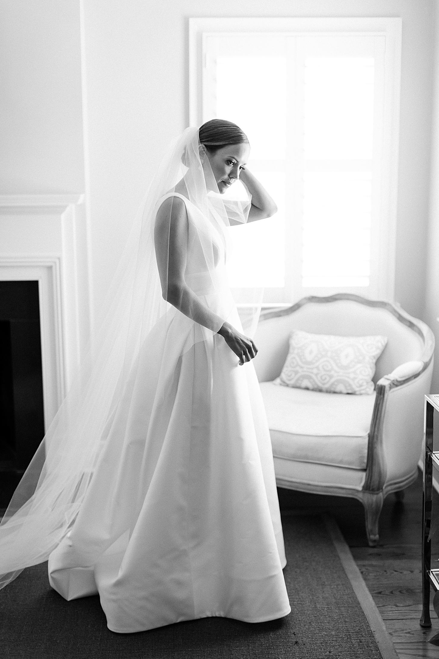 Bride wearing Carolina Herrera at home Traditional Family Wedding at Belle Haven Country Club in Alexandria by Sarah Bradshaw