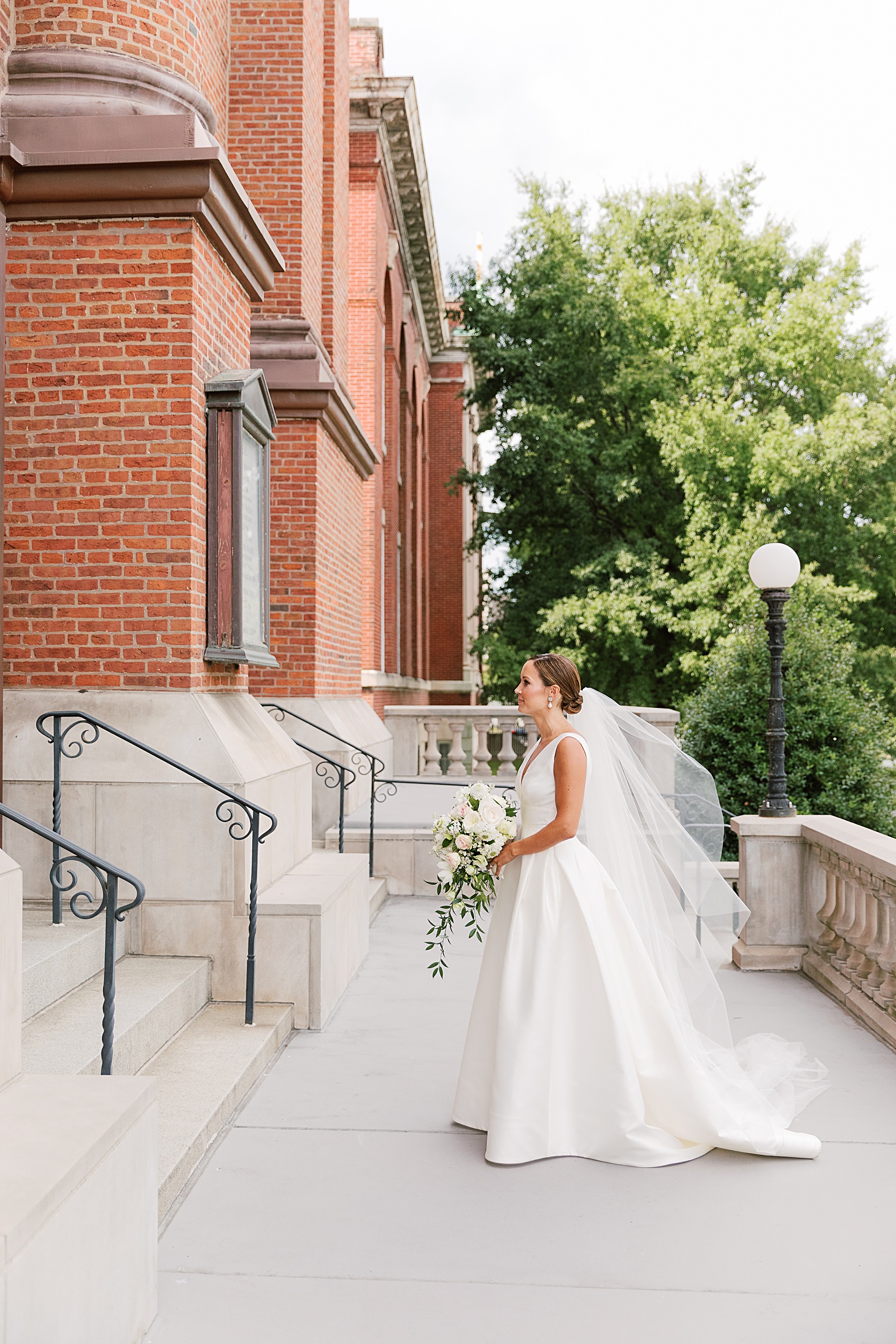 Bride before ceremony at St Aloisius at Gonzaga  | Traditional Family Wedding at Belle Haven Country Club in Alexandria by Sarah Bradshaw