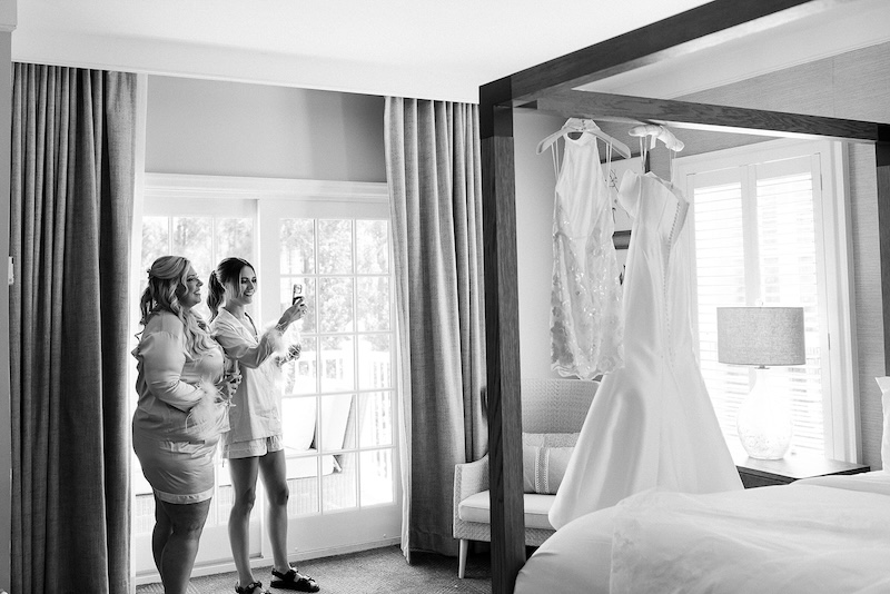 Bridesmaids in matching Pjs, two bridal dresses for wedding day. Elegant wedding at the Ritz-Carlton Lake Oconee in Georgia. Sarah Bradshaw Photography.