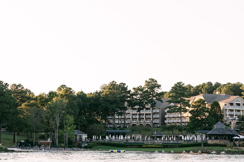 Views of the resort from the lake. Elegant wedding at the Ritz-Carlton Lake Oconee in Georgia. Sarah Bradshaw Photography.