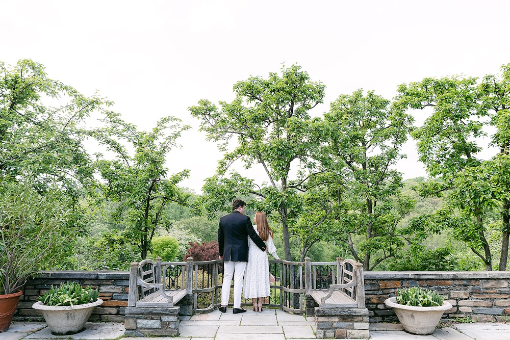 Couple overlooking scenic view. Spring wedding engagement photo session. Sarah Bradshaw Photography.