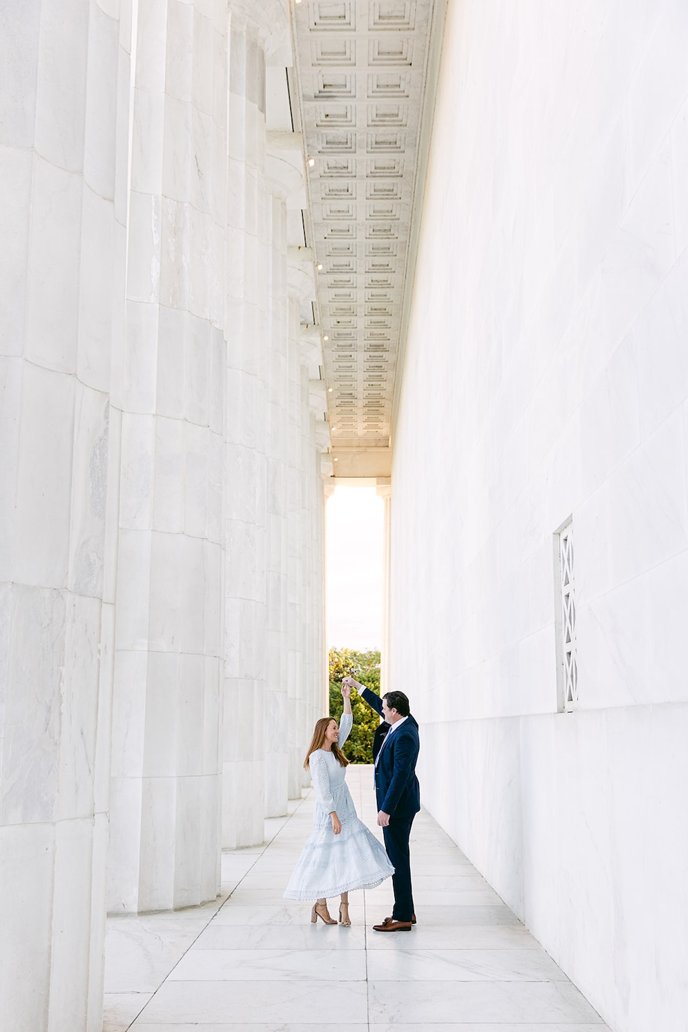 Engaged couple dances at the Lincoln Memorial in Washington DC. Spring wedding engagement photo session. Sarah Bradshaw Photography.