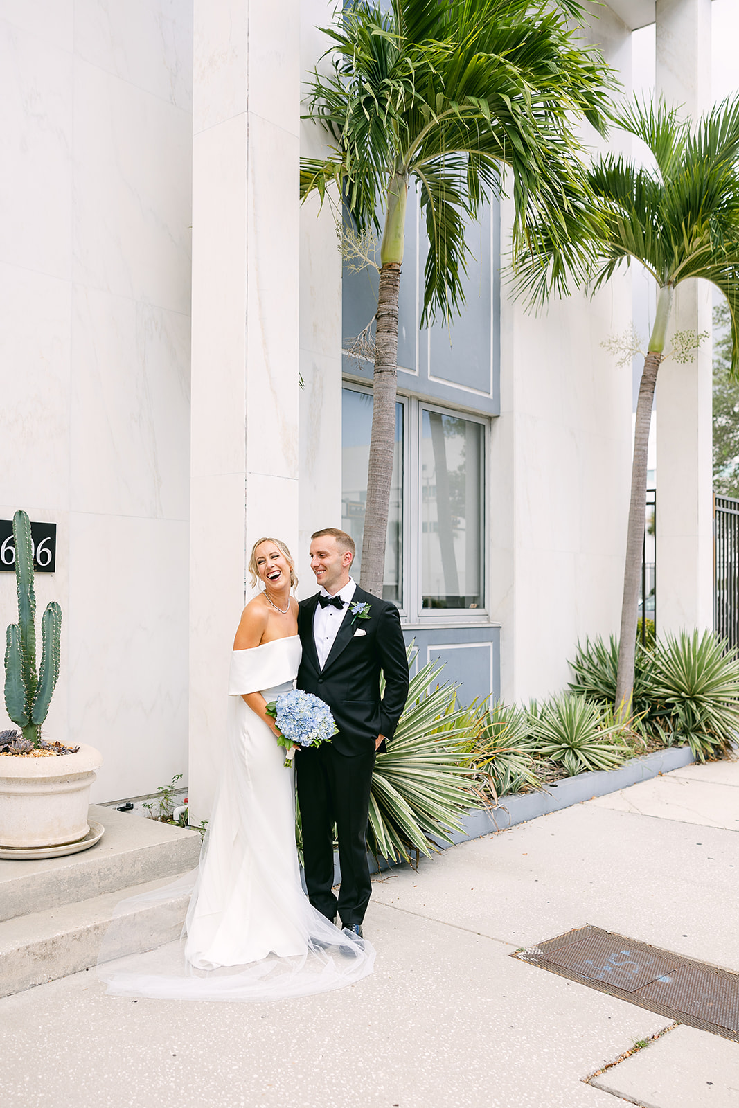wedding portrait posing bride and groom. something blue bridal bouquet. high end elopement wedding in tampa florida. sarah bradshaw photography.