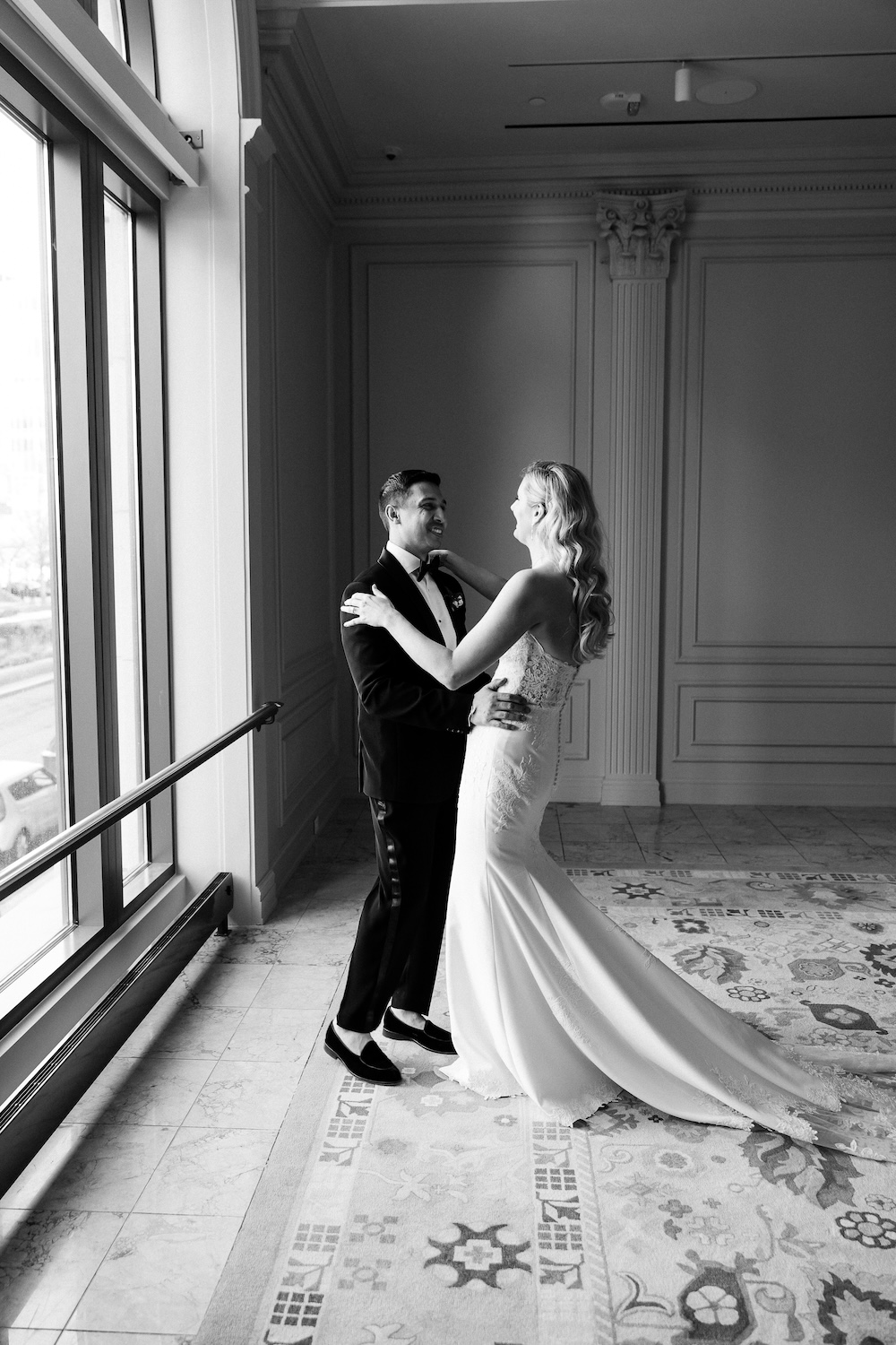 Bride and Groom wedding day first look reveal in front of large window. Modern Washington DC wedding at National Museum of Women in the Arts. Sarah Bradshaw Photography.