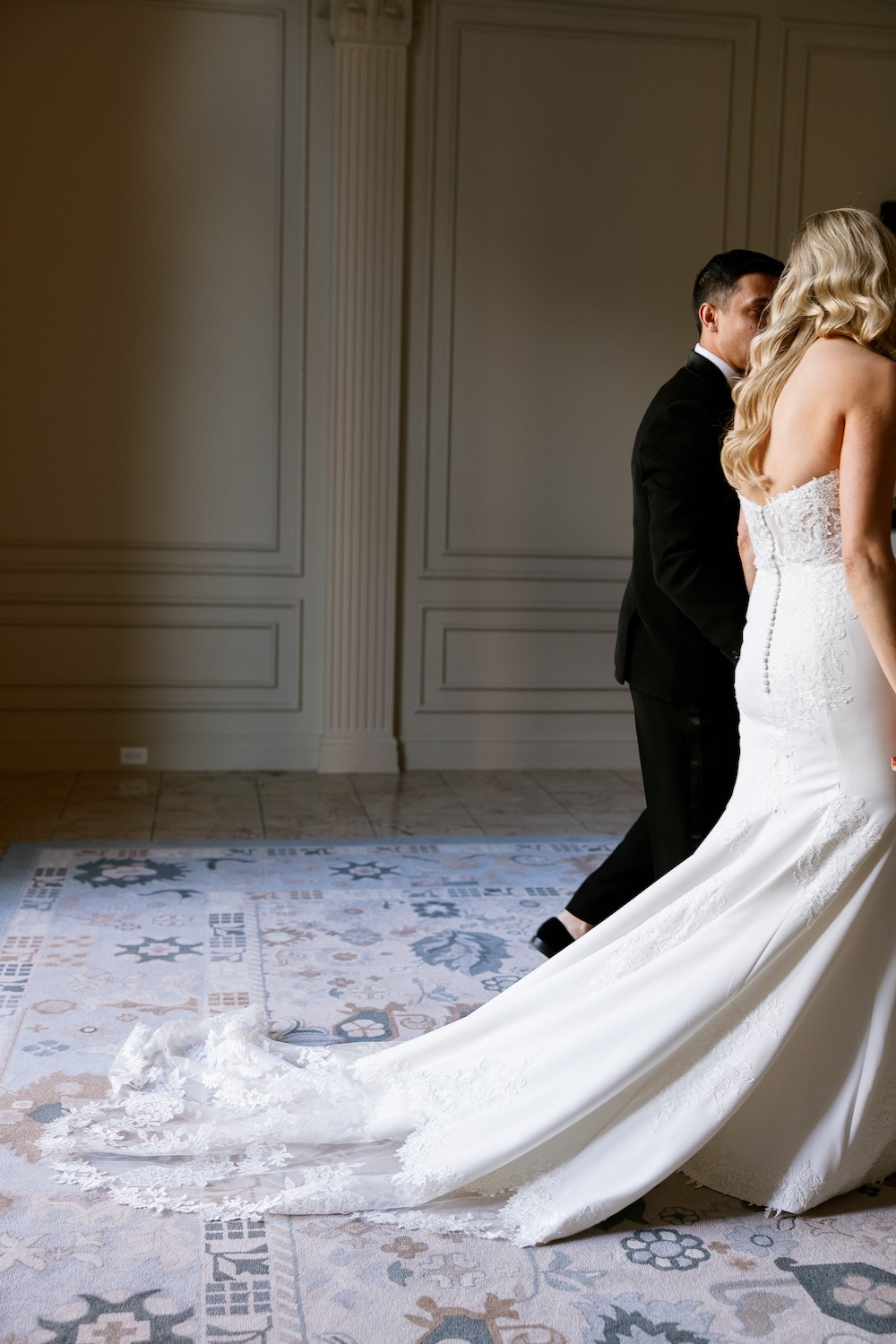 Portrait of bride and groom walking. Modern Washington DC wedding at National Museum of Women in the Arts. Sarah Bradshaw Photography.