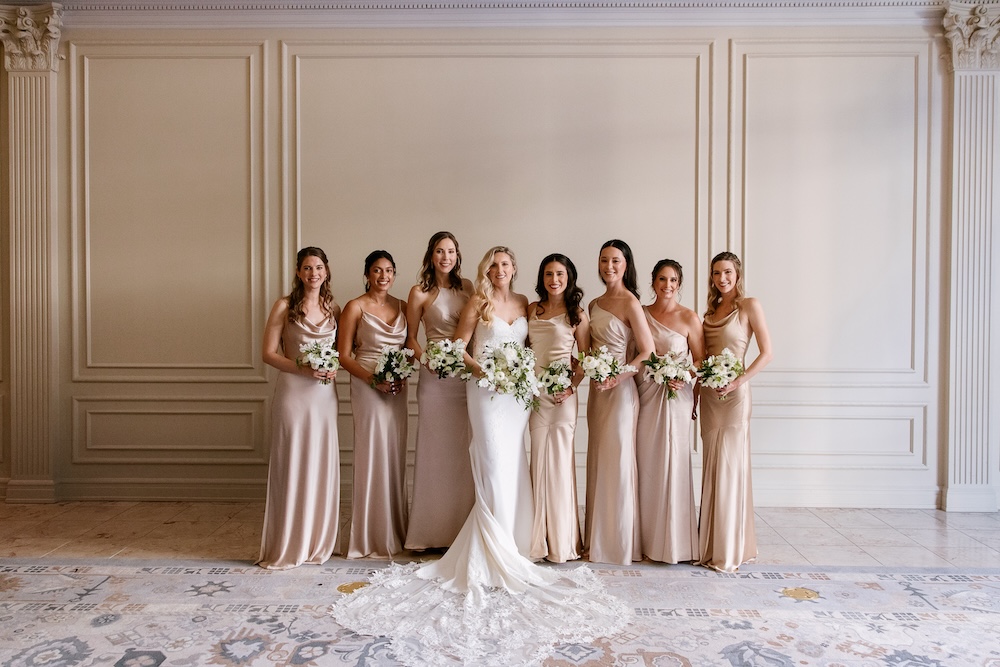 Bride with bridesmaids in champagne blush dresses. Modern Washington DC wedding at National Museum of Women in the Arts. Sarah Bradshaw Photography.