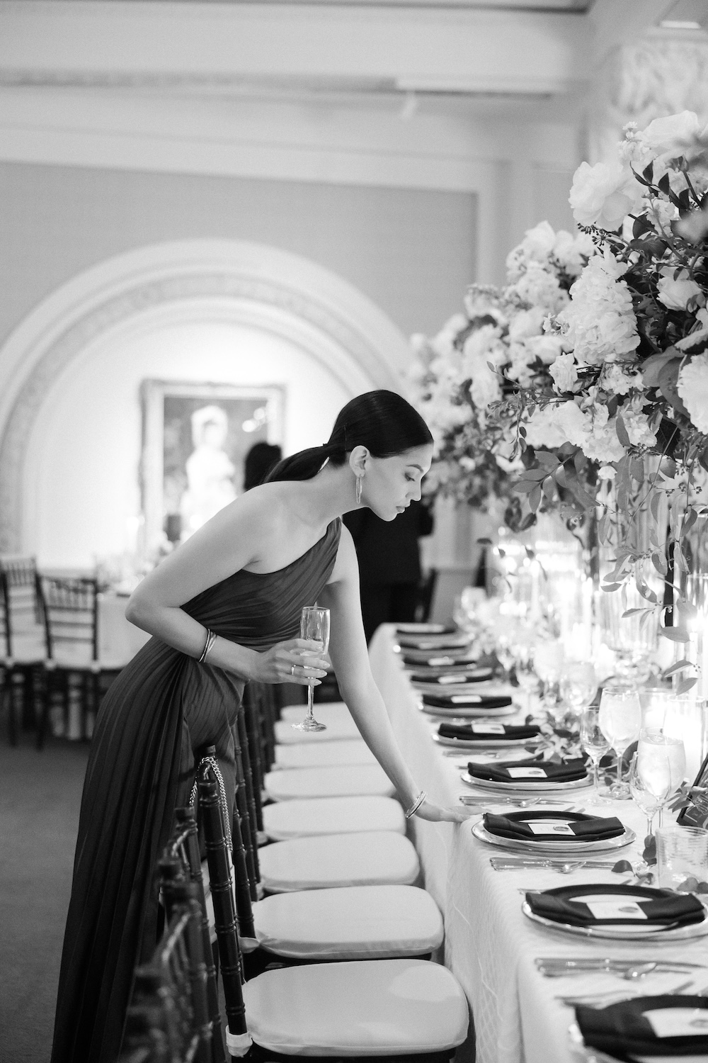 Wedding guest looks for place card. Modern Washington DC wedding at National Museum of Women in the Arts. Sarah Bradshaw Photography.