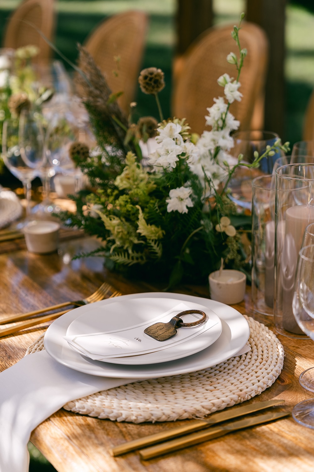 Monochromatic, neutral color palette place setting design. Elevated boho chic tablescape. Milestone birthday party celebration weekend in Middleburg, Virginia. Sarah Bradshaw Photography.