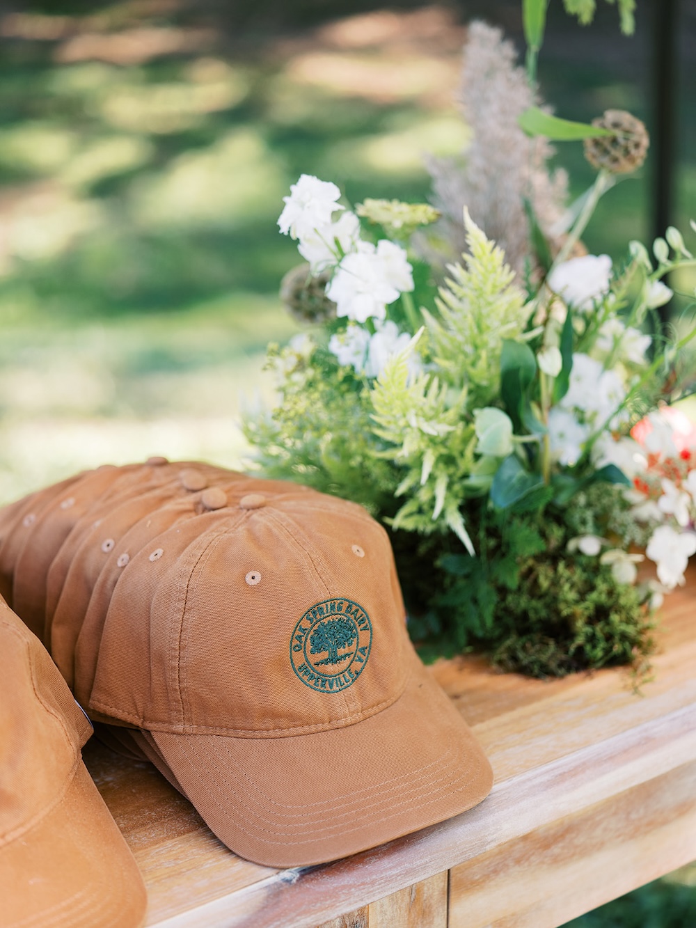 Custom branded hats, unique party favor idea. Milestone birthday party celebration weekend in Middleburg, Virginia. Sarah Bradshaw Photography.