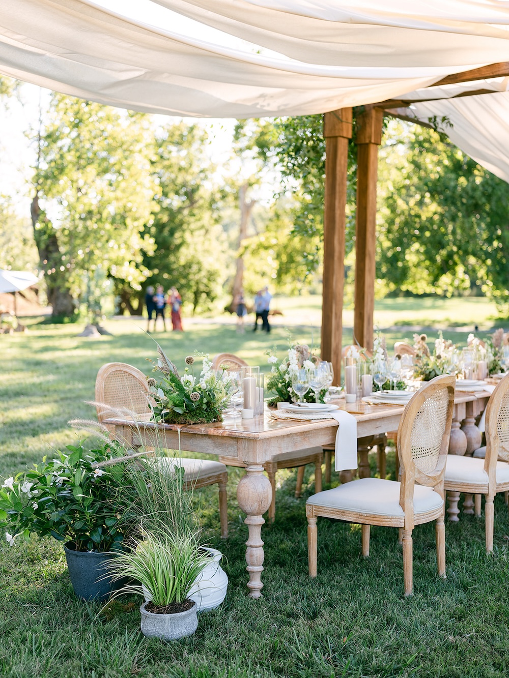 Boho chic dinner design, farmhouse tables. Neutral color palette. Milestone birthday party celebration weekend in Middleburg, Virginia. Sarah Bradshaw Photography.