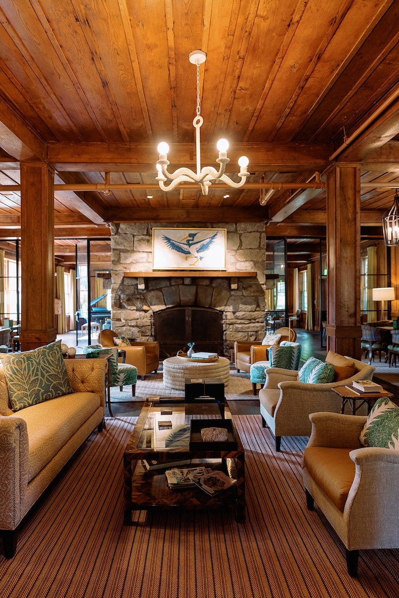 Stone fireplace, cozy seating lounge in mountain lodge. High Hampton in North Carolina, Sarah Bradshaw Photography