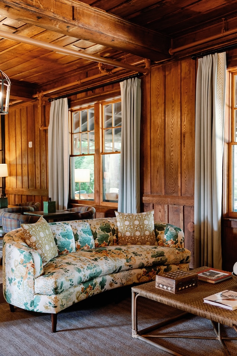 floral printed couch in wood paneled den, mountain inn. High Hampton in North Carolina, Sarah Bradshaw Photography