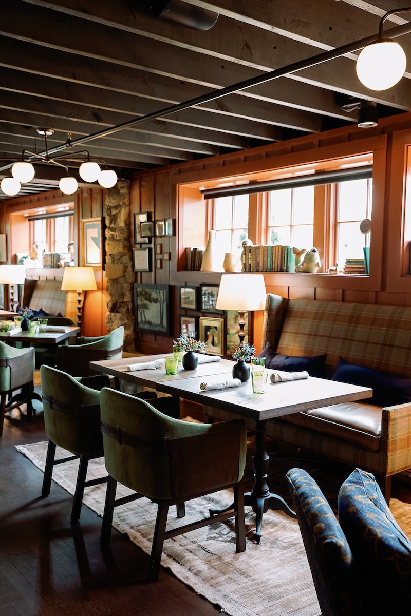 Cozy dining space in wood paneled den of luxe mountain resort. High Hampton in North Carolina, Sarah Bradshaw Photography