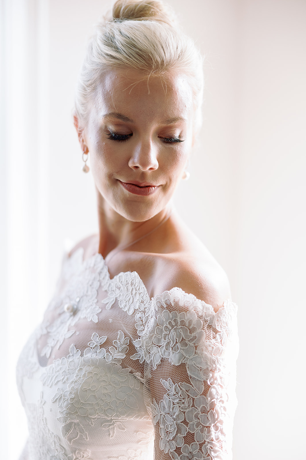 bridal portrait, lace bolero, high bun hairstyle, pearl necklace. Classic Black Tie wedding in Georgetown, SC. Sarah Bradshaw Photography