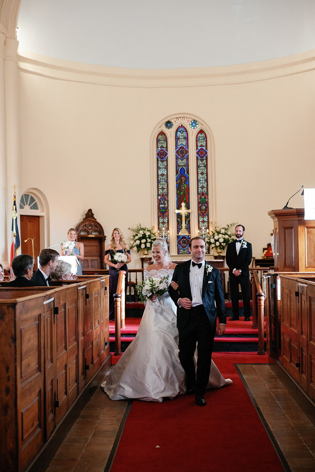 bride and groom walk down the aisle after wedding ceremony. Classic Black Tie wedding in Georgetown, SC. Sarah Bradshaw Photography