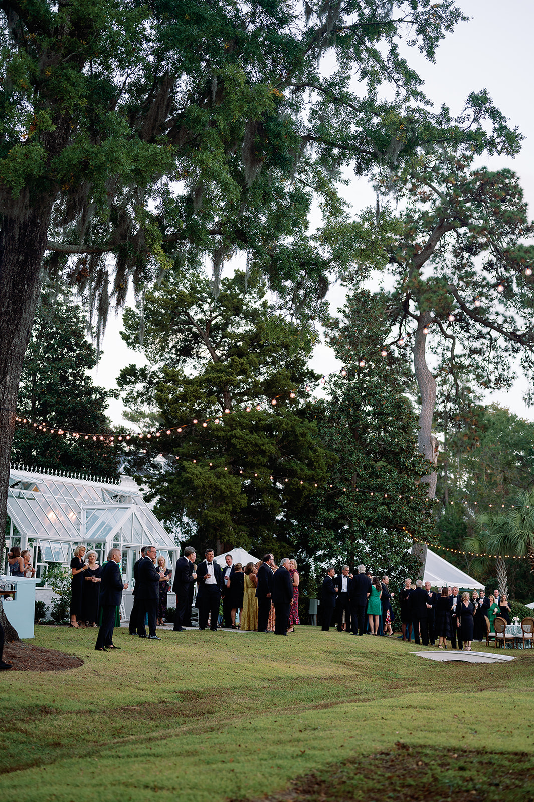 Outdoor wedding cocktail hour at private residence. Classic Black Tie wedding in Georgetown, SC. Sarah Bradshaw Photography