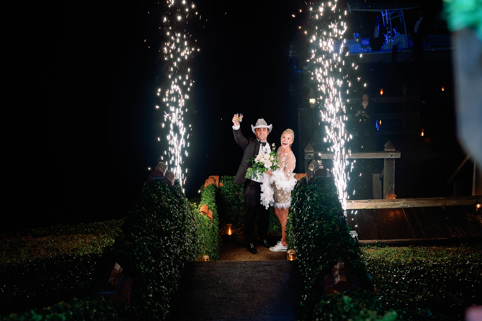 Wedding exit sparklers, bride in short reception dress. Classic Black Tie wedding in Georgetown, SC. Sarah Bradshaw Photography