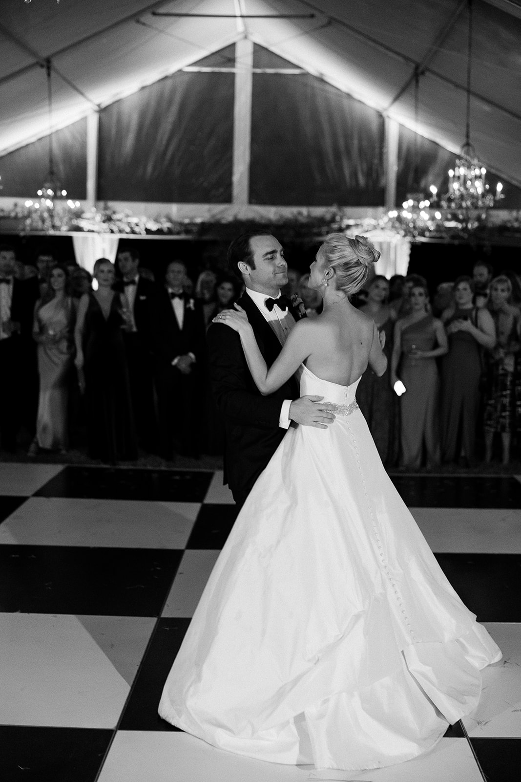 bride and groom first dance in wedding tent. Classic Black Tie wedding in Georgetown, SC. Sarah Bradshaw Photography