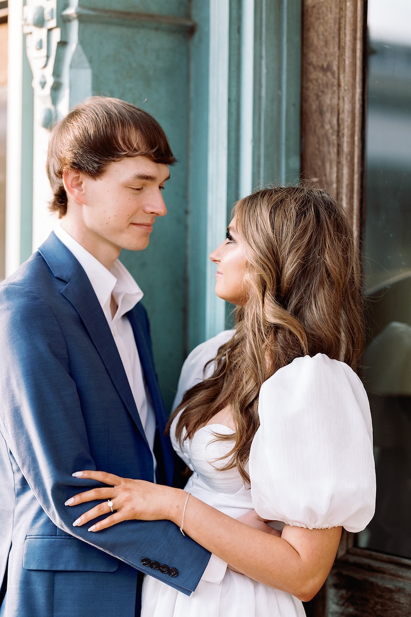 traditional wedding engagement photo posing. pouf sleeve little white dress. sarah bradshaw photography. 