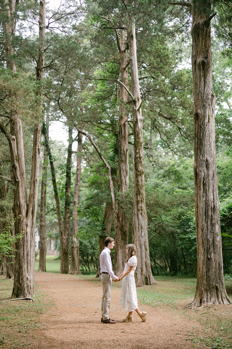 portrait of couple on tree lined street. southern wedding engagement session, sarah bradshaw photography.