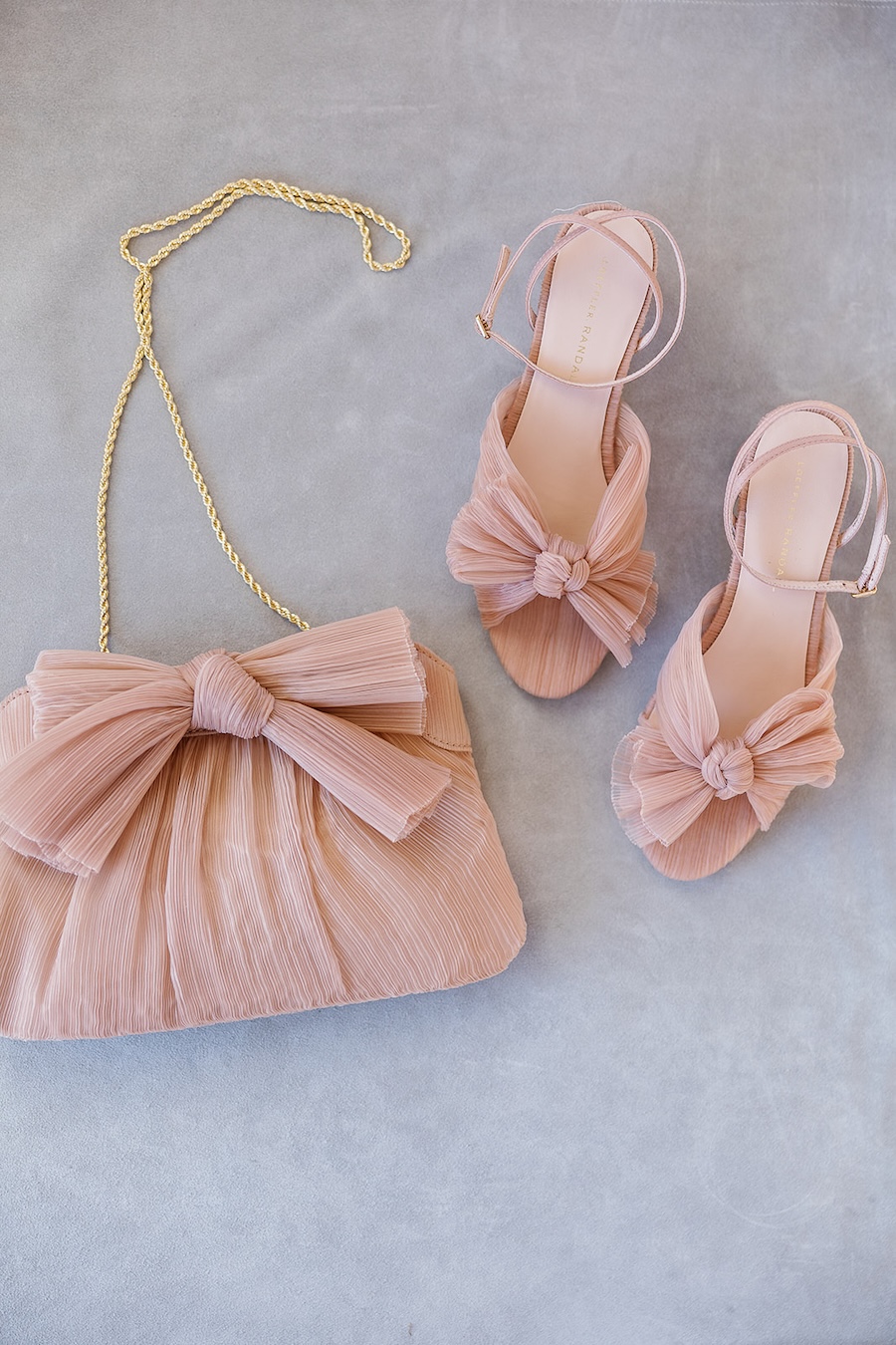 Feminine pink bridal heels and purse with bow details. Timeless winter wedding, anderson house, washington dc, sarah bradshaw photography.