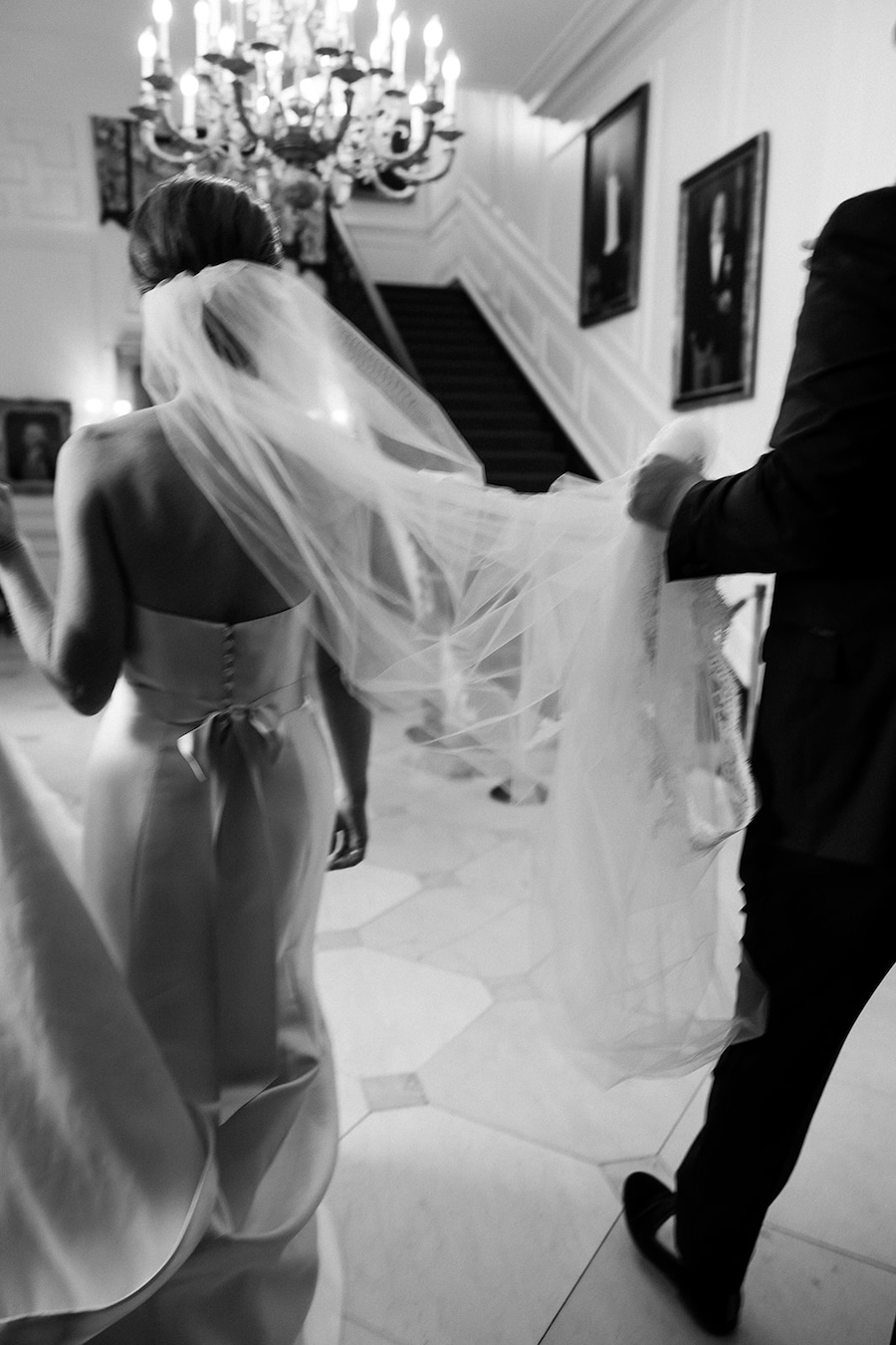 motion blur portrait of bride and groom walking. Timeless winter wedding, anderson house, washington dc, sarah bradshaw photography.