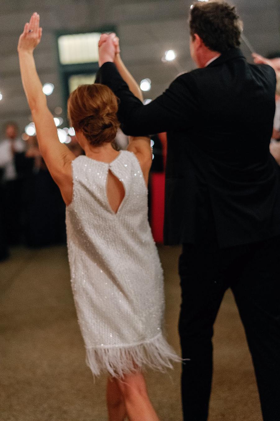 wedding reception exit. bride in sparkle and fringe mini dress. Timeless winter wedding, anderson house, washington dc, sarah bradshaw photography.