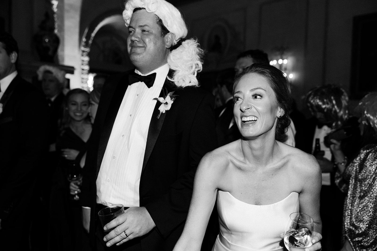 bride and groom dancing with groom wearing presidential inspired wig. Timeless winter wedding, anderson house, washington dc, sarah bradshaw photography.