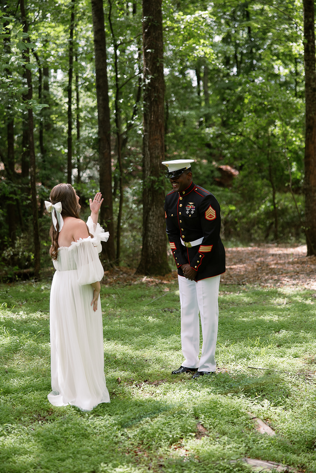bride and groom first look wedding reveal. Bride in long sleeve tulle dress, groom in military uniform. Spring wedding in South Carolina. Sarah Bradshaw Photography