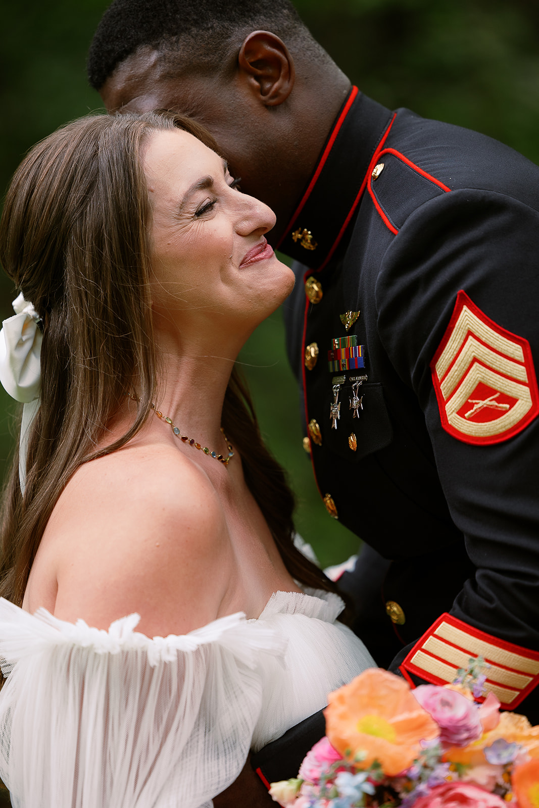 bride smiling while groom hugs her. off shoulders tulle wedding dress. private home wedding south carolina. Sarah Bradshaw Photography