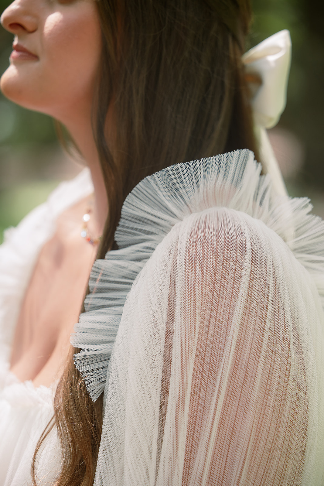 close up detail of tulle on bride's wedding dress sleeve. custom bridal gown. spring wedding in south carolina. Sarah Bradshaw Photography