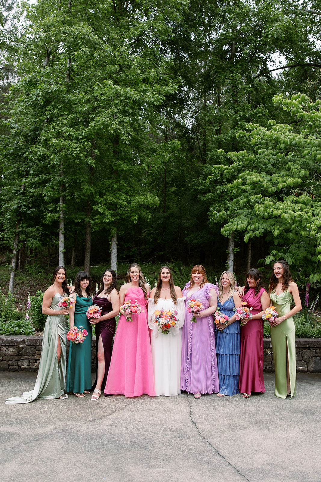 bridal party portrait, colorful mix and match bridesmaids dresses. south carolina wedding. Sarah Bradshaw Photography