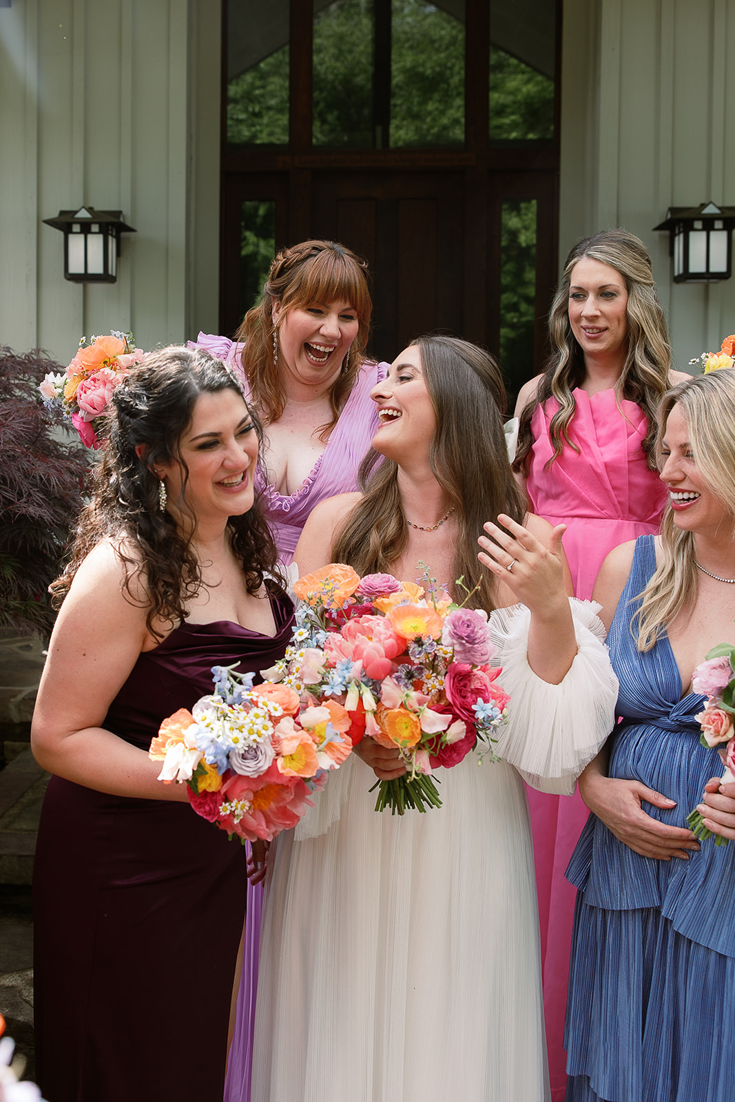 candid bridal party portrait. bride and bridesmaids laugh. spring wedding in south carolina. Sarah Bradshaw Photography
