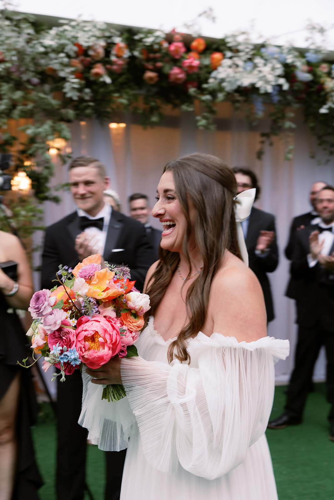 bride smiles walking down the aisle. private home tented wedding in south carolina. Sarah Bradshaw Photography