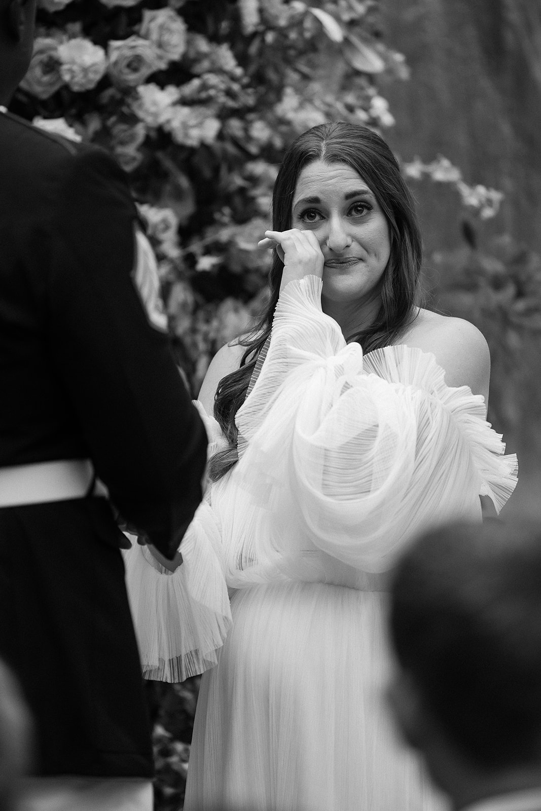 bride wipes away tears during vow exchange. Spring, private home tented wedding in south carolina. Sarah Bradshaw Photography