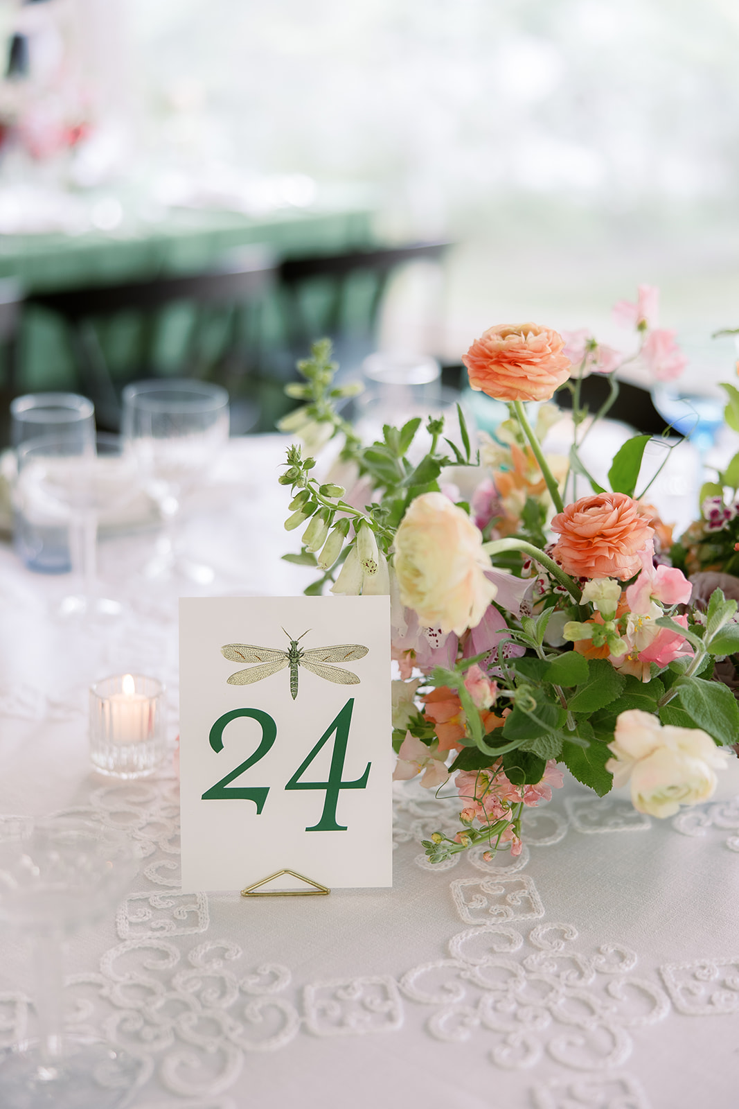 Colorful wedding centerpiece, table number with insect. Spring, private home tented wedding in south carolina. Sarah Bradshaw Photography